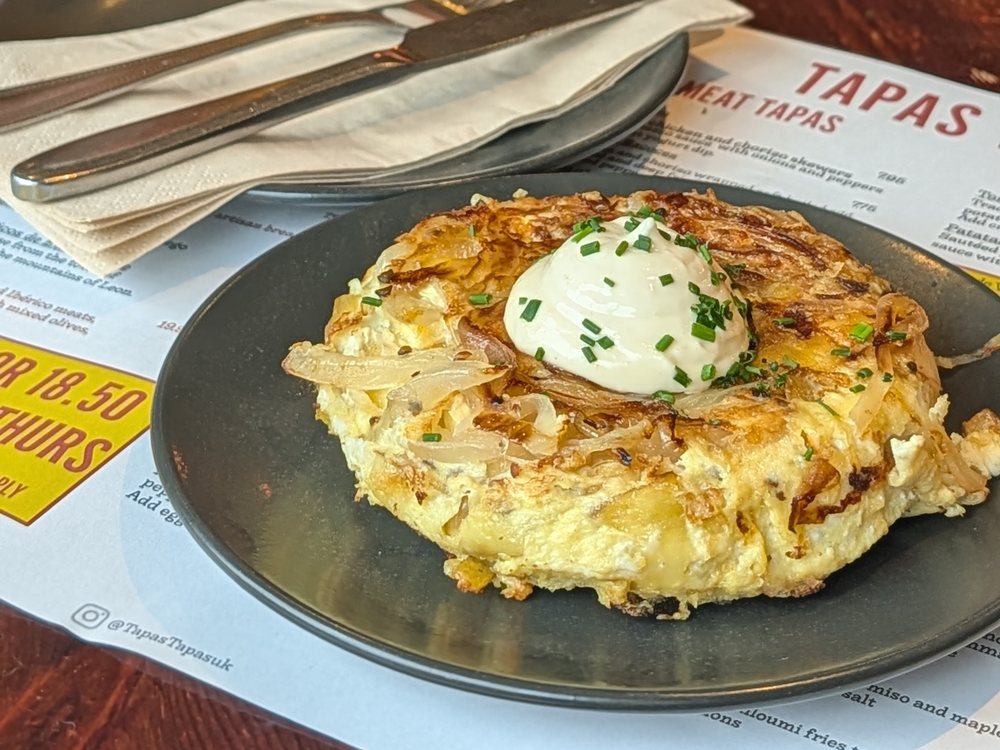 Tortilla de Patatas: Spanish potato omelette topped with aioli and chives